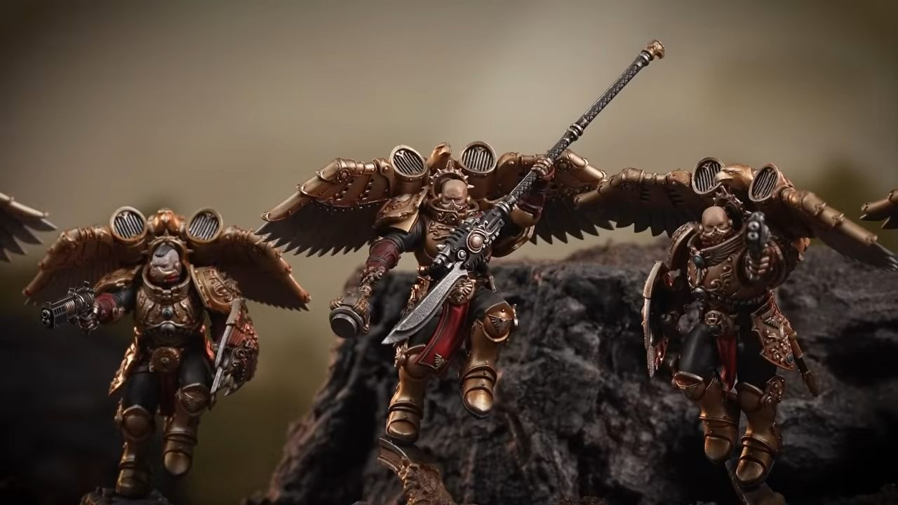 Warhammer Custodes miniatures on a blasted battleground