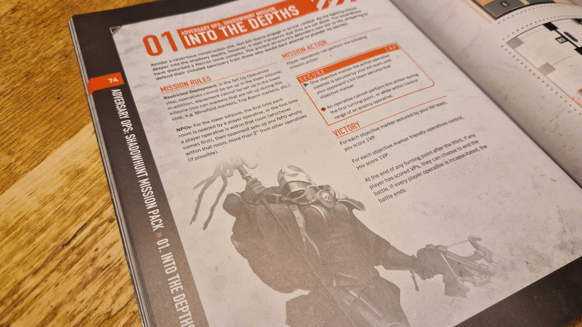 A page of text with an illustration of an armored woman, on a wooden surface