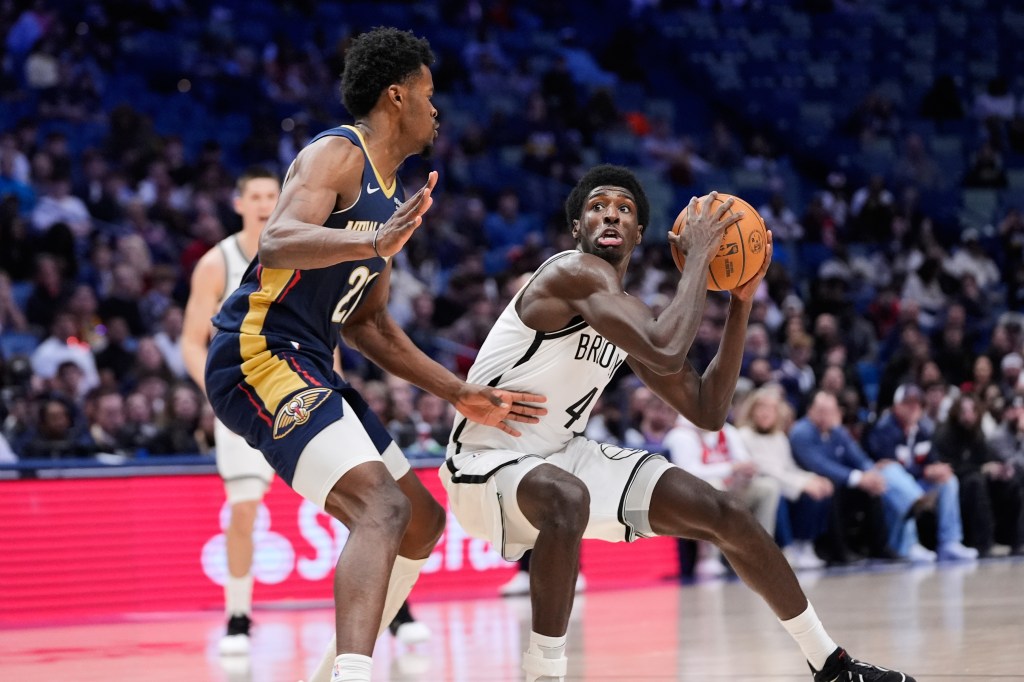 Drake Powell (4) looks to shoot against New Orleans Pelicans center Yves Missi (21) in the second half of an NBA basketball game, Wednesday, Jan. 14, 2026, in New Orleans. 
