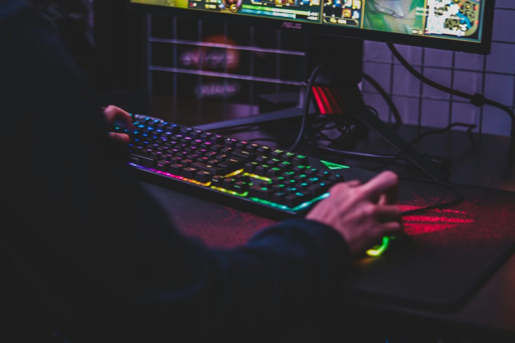 7 Underrated Gaming Accessories That Boost Performance and Improve Your Gameplay Person Using Computer
