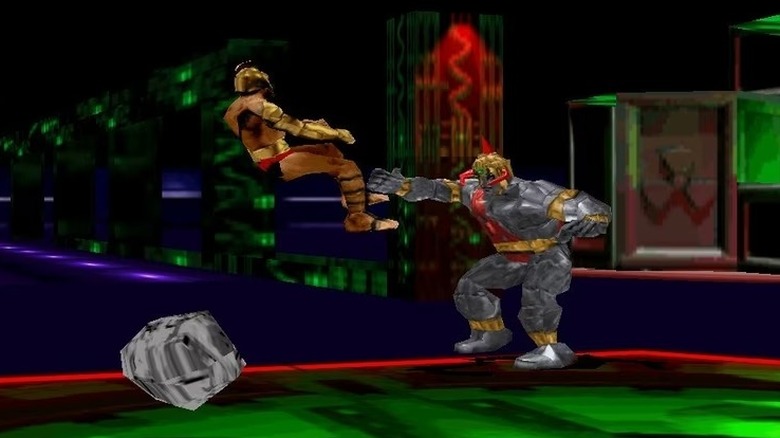 Tak is flung backward by Warhead in War Gods