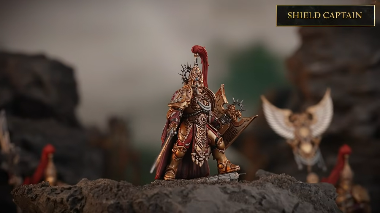 Warhammer Custodes miniatures on a blasted battleground