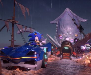 In Sonic Racing: CrossWorlds, Sonic poses to the camera while driving towards the titular kraken of the Kraken Bay circuit