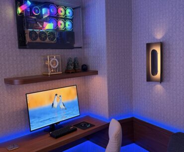 Floating desk, wall-mounted PC, and a chill place to work and play.