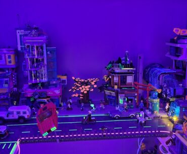 Awesome looking effect using blacklight on miniature cyberpunk city