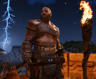 A character from God of War stands in front of a torch with a lightning strike in the background.