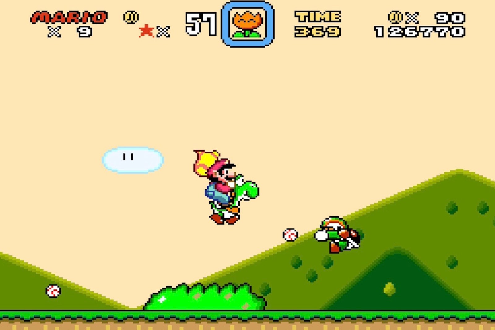 Gameplay from Super Mario World, where a caped Mario rides Yoshi toward a baseball-flinging Chargin' Chuck