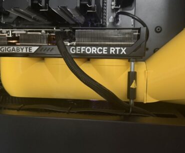 A 3d printed yellow air duct for a gaming pc, from Reddit user 'Esra-Zander'