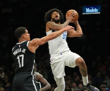Mavericks beat Nets 123-114 after both teams arrive on game day because of blizzard