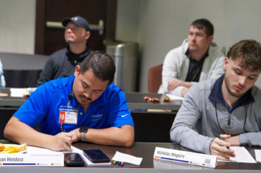 Two male students attend a seminar aimed at strengthening Oklahoma’s tribal gaming workforce.