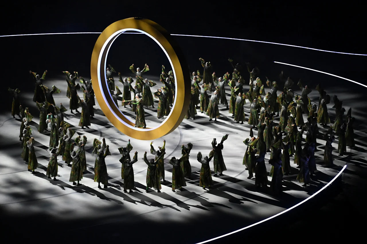 Dancers perform during the opening ceremony of the Milano Cortina 2026 Winter Olympic Games at the San Siro stadium in Milan, northern Italy, on February 6, 2026. (Photo by PIERO CRUCIATTI / AFP via Getty Images)