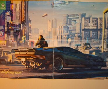 I've had an old E3 Xbox magazine poster of Cyberpunk on my wall for years. Decided to recreate the screenshot in game as best I could