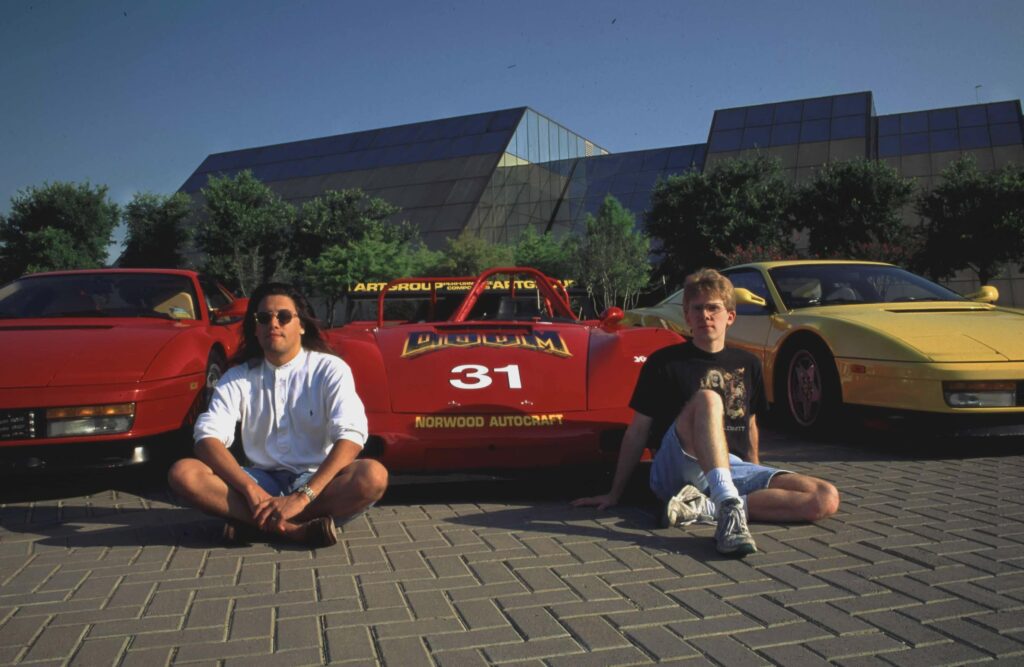 The Masters of Doom - John Romero and John Carmack with their matching Ferraris.