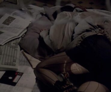 Homeless woman getting some rest while her PC compiles