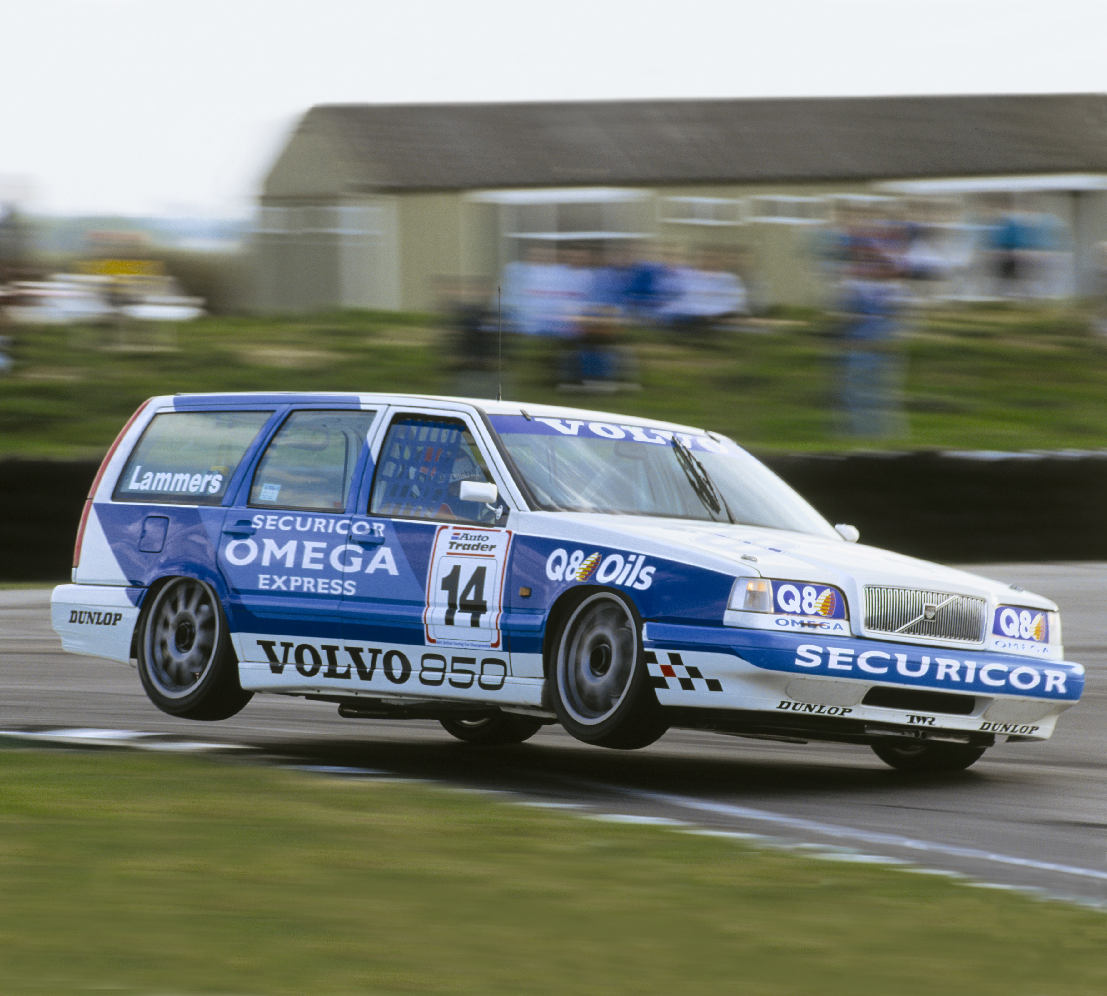 A Volvo 850 Estate racing car corners on two wheels.
