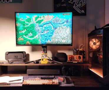 Upgraded from a $100 IKEA desk to $300 worth of solid red oak, whole lot of handiwork, and a custom 3D printed cable box.