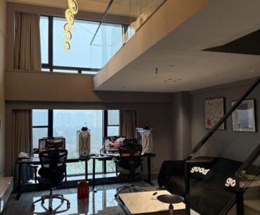 Turned my double-height loft into a “cyber-zen” battlestation. When the lights are off and only this chandelier is on… it hits different.