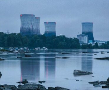 AI cooling towers under a sky with the color of television, tuned to a dead channel (real)
