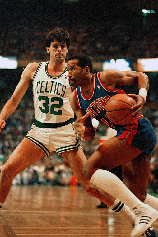Adrian Dantley of the Detroit Pistons, right, moves past Boston Celtics Kevin McHale on his way to the basket in first quarter action in Boston Garden, May 26, 1987.