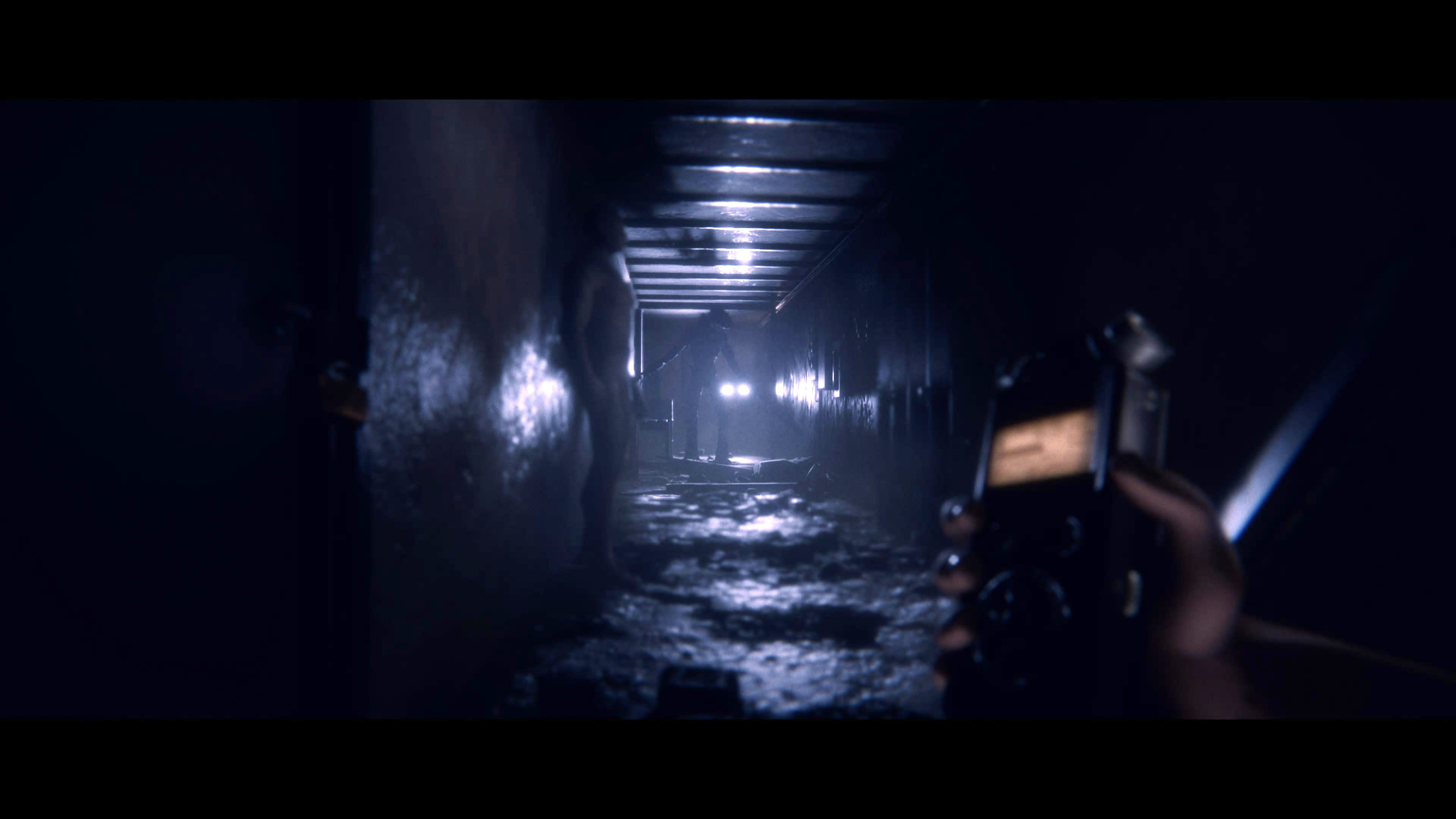 A dark hallway with low lighting