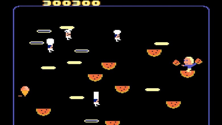 Charley Chuck prepares to throw slices of watermelon at incoming chefs in 