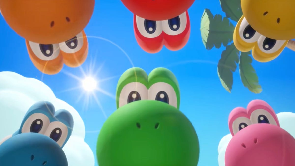 Switch 2 Pricing Shift: Nintendo Says Its Physical Games Will Cost $10 More different color yoshis look down at the camera