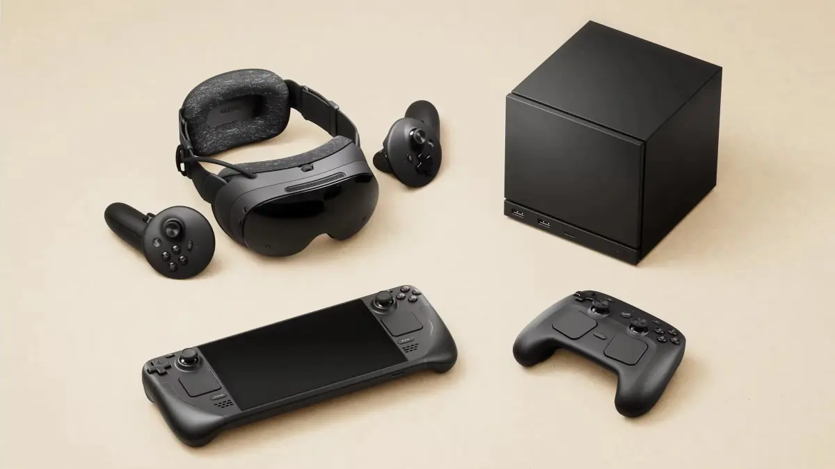 The Valve Steam Machine gaming console, VR headset, and controllers are arranged on a light background.