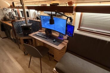 Battlestation in my 2002 converted Blue Bird bus.
Solar powered, Starlink internet, and a cat that keeps getting me killed in Arc Raiders.