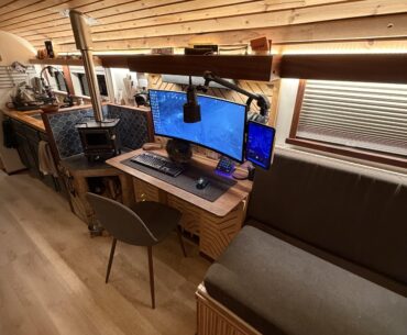 Battlestation in my 2002 converted Blue Bird bus.
Solar powered, Starlink internet, and a cat that keeps getting me killed in Arc Raiders.