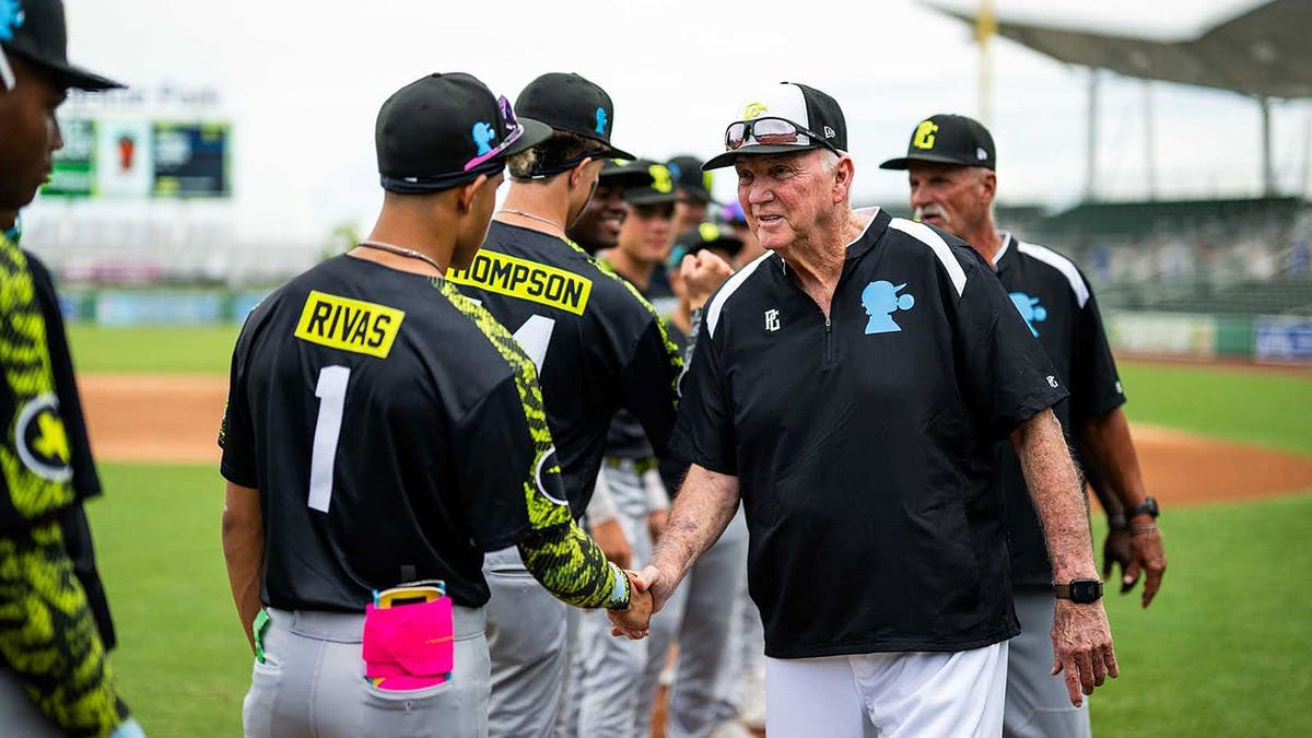 Charlie Manuel shakes players hands
