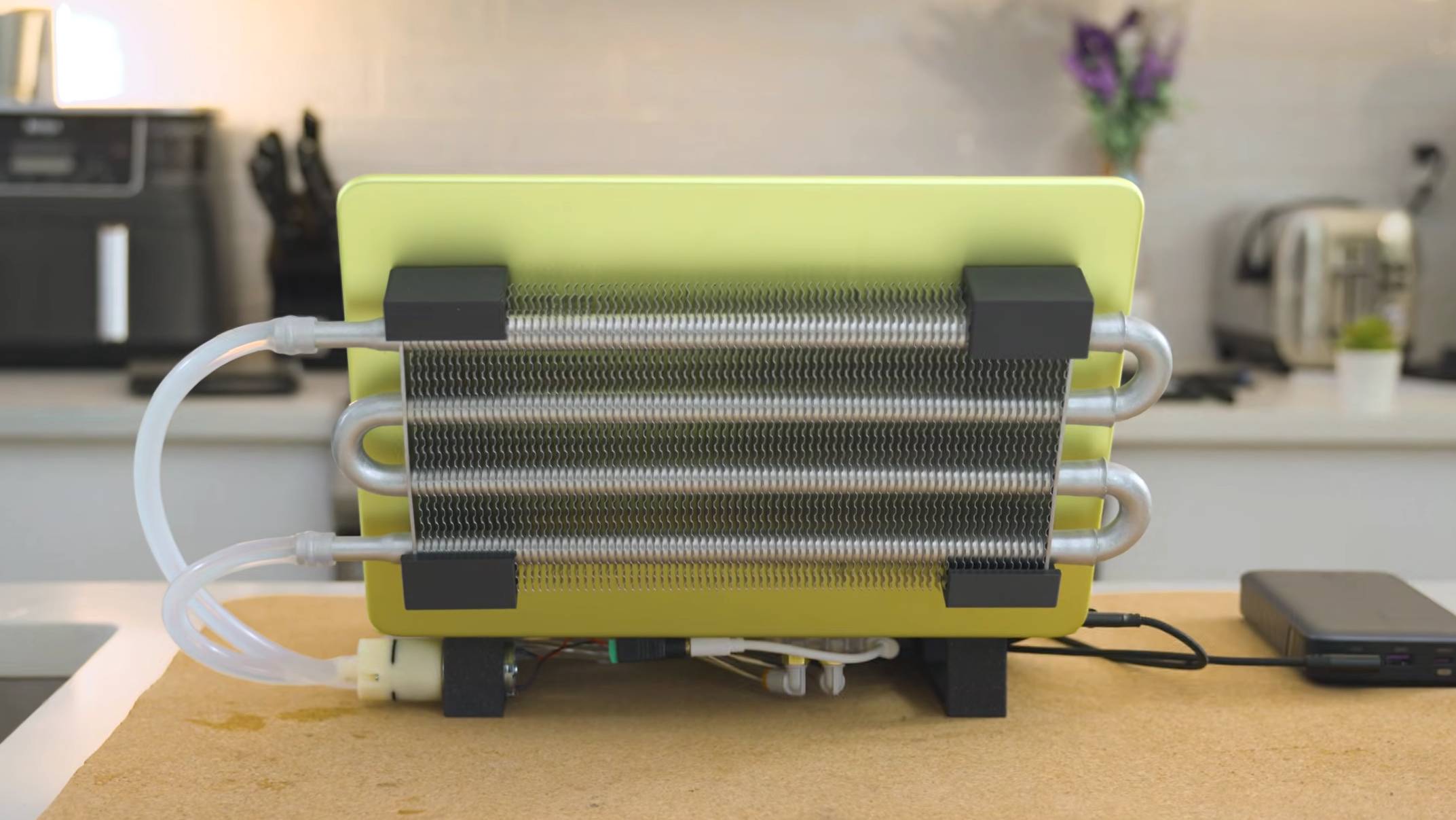 A water cooled Apple MacBook Neo.