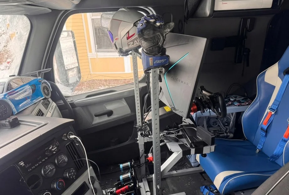One truck driver installed a $6,000 racing simulator and Gaming PC in his cab to run Virtual laps during highway traffic stops and mandatory rest periods