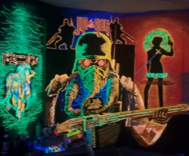 Gaming room full of wallpaintings in soft 8w Uv lighting..