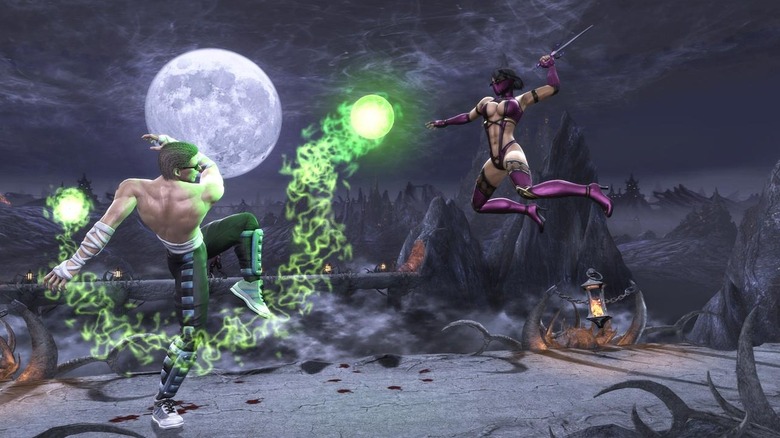 Johnny Cage flings an energy blast at Mileena as she lunges at hm in 