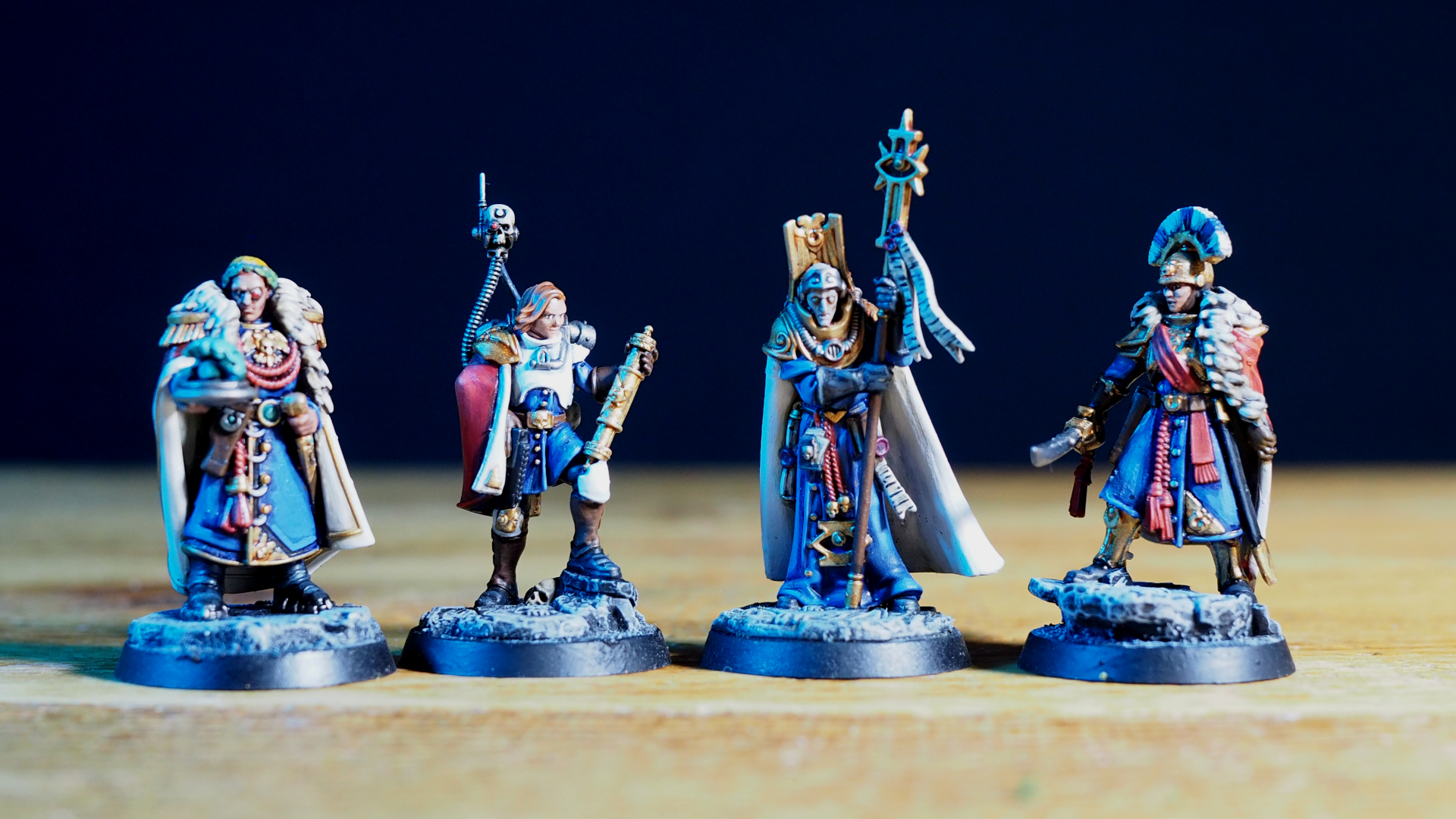 Four Imperial models on a wooden table, in a row