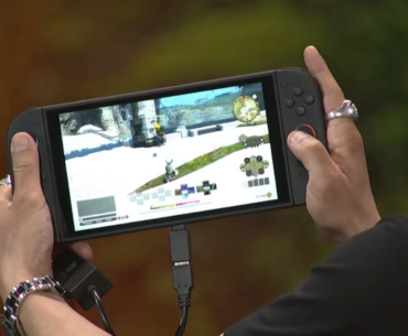a switch 2 playing final fantasy 14 is being held in two hands