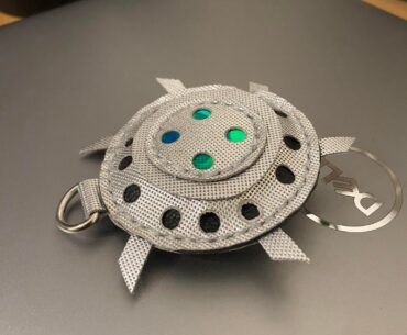 I made a Bouncing Betty Keychain out of leather scrap and some holo pvc.