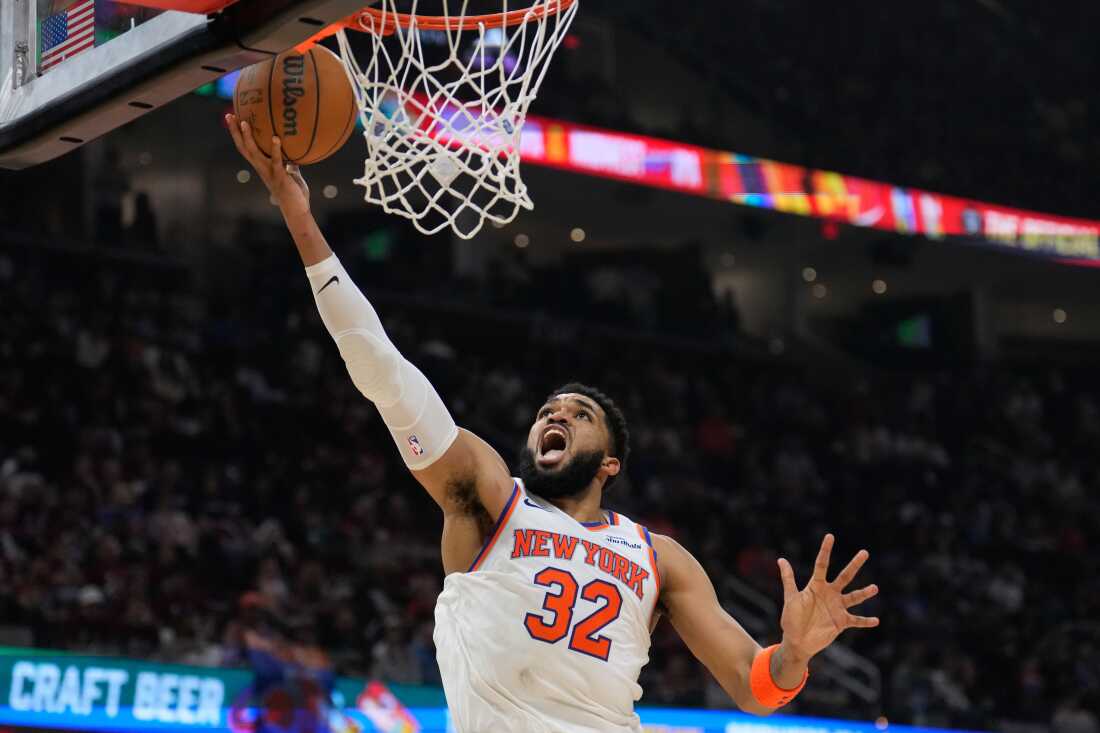 New York Knicks center Karl-Anthony Towns (32) shoots during the second half of Game 4 in the Eastern Conference finals NBA basketball playoffs series against the Cleveland Cavaliers in Cleveland, Monday, May 25, 2026.