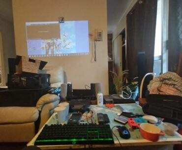 Gpd win 4 based setup with PC graveyard and home theatre system.