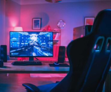 Gaming PC rig with RGB workstation and empty gaming chair