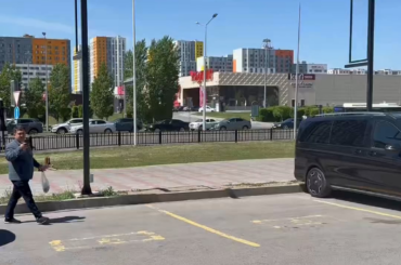 There is a bus in Astana with Parivision coach Dastan's face on it