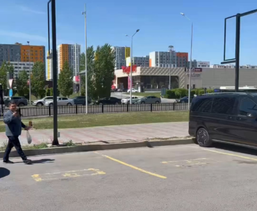 There is a bus in Astana with Parivision coach Dastan's face on it