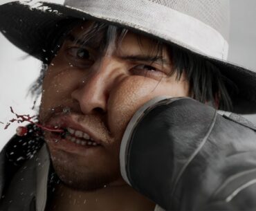 A close-up image shows a man in a hat being punched, with blood and water splattering, featuring the 'Ryu Ga Gotoku Studio' logo in the corner.