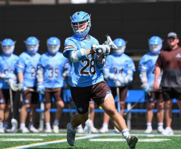 Chase Beyer of Tufts cradles the lacrosse ball