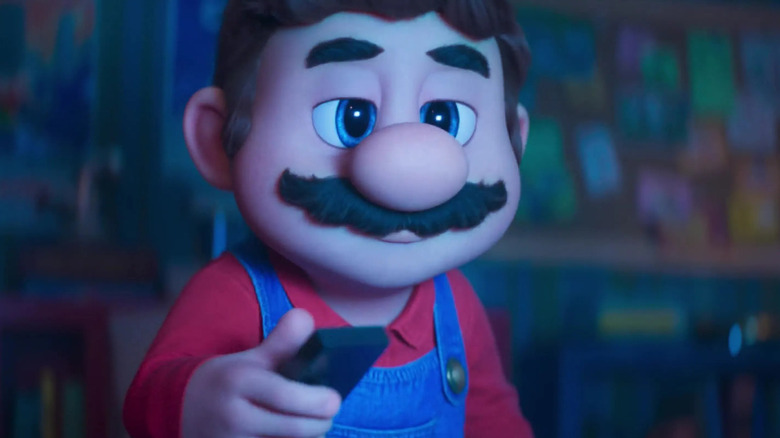 Mario holding a TV remote in The Super Mario Bros. Movie