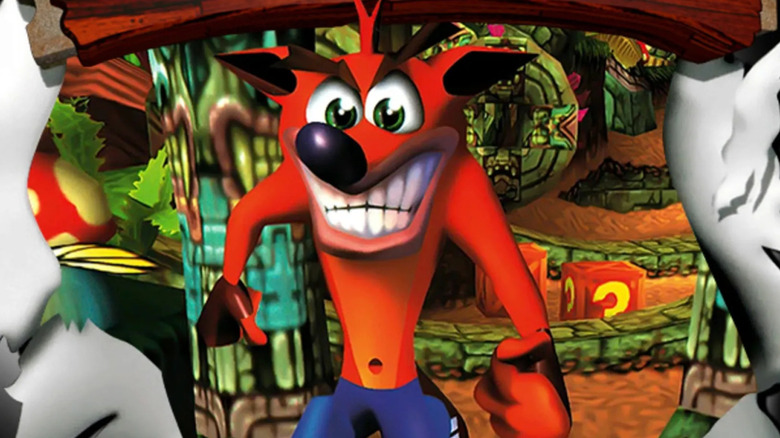 Crash Bandicoot bursts through a paper wall on the cover art for 