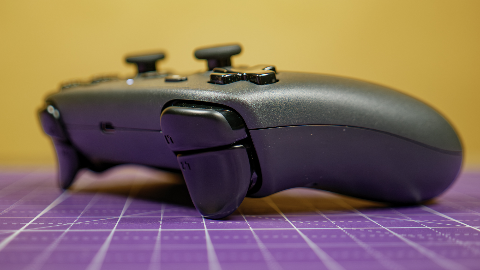 The Steam Controller flat on a desk.