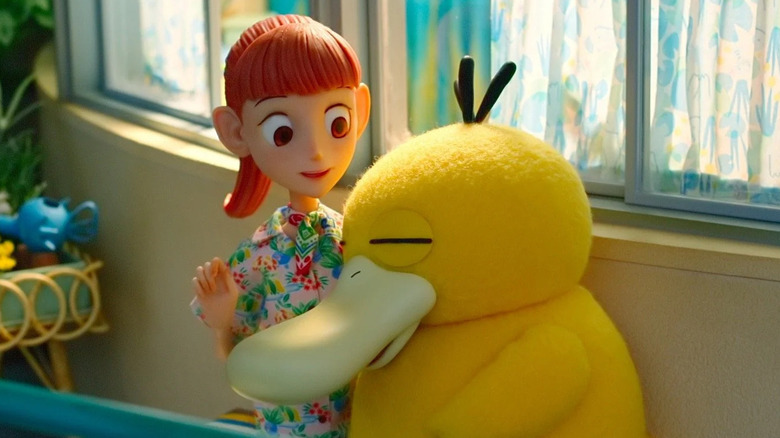 Haru comforting Psyduck on a balcony in Pokemon Concierge