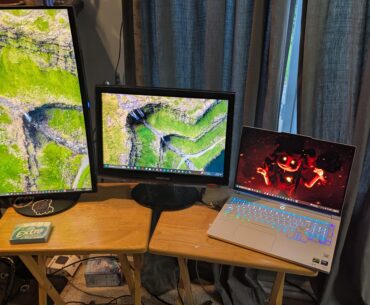 I have no idea what I'm doing. We got a gaming laptop, a curved, VERTICALLY MOUNTED gaming monitor (which is somewhat broken), and we got an old Samsung monitor from 2008, all standing on two fold out tables. If that's not shitty, then I must be doing something wrong.
