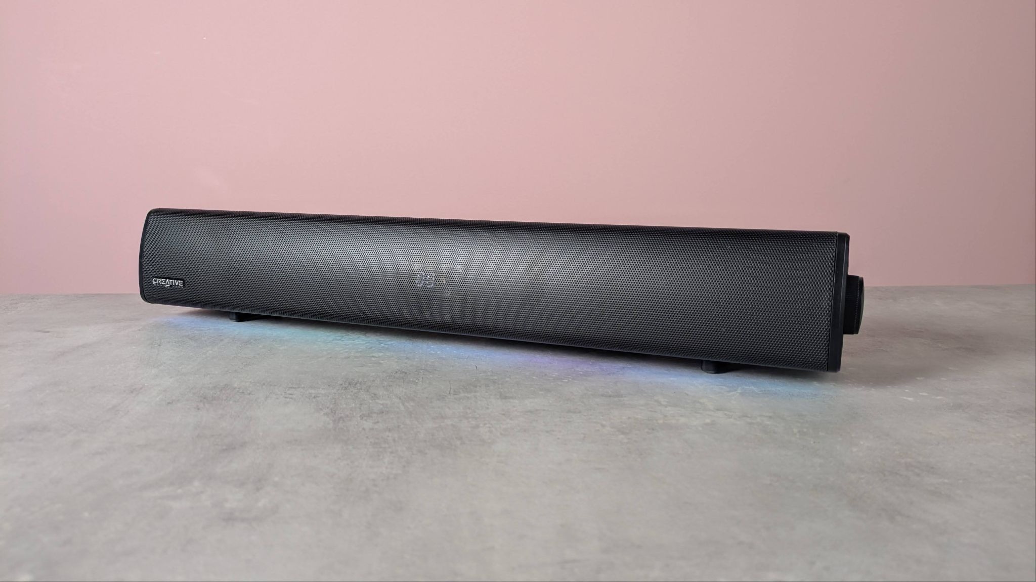 Creative Sound Blaster GS5 on a desk with pink wall in background